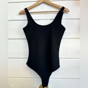 Black body suit, with snap bottom! Thick material, one of our best sellers!